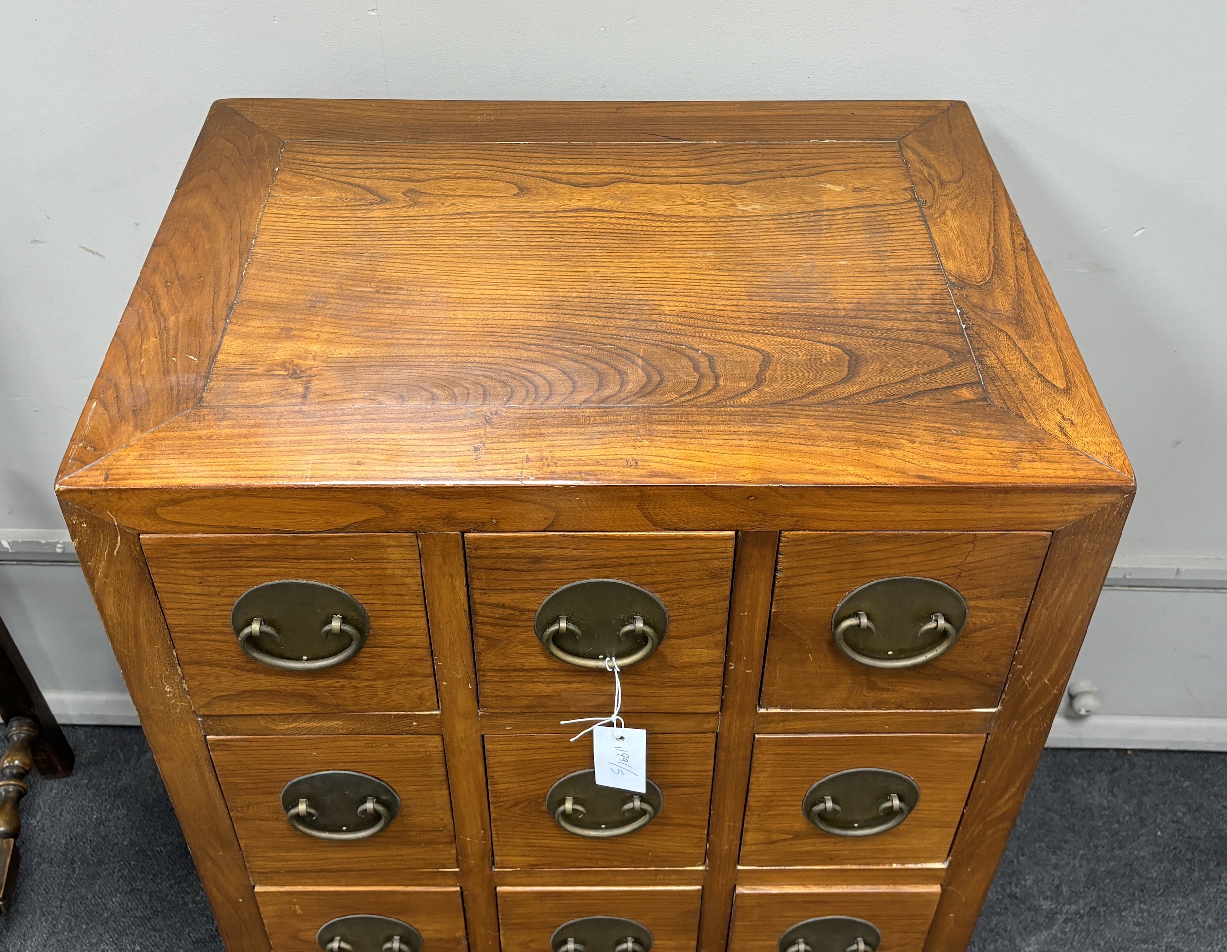 A Chinese jumu chest of twelve drawers, width 61cm, depth 45cm, height 91cm.